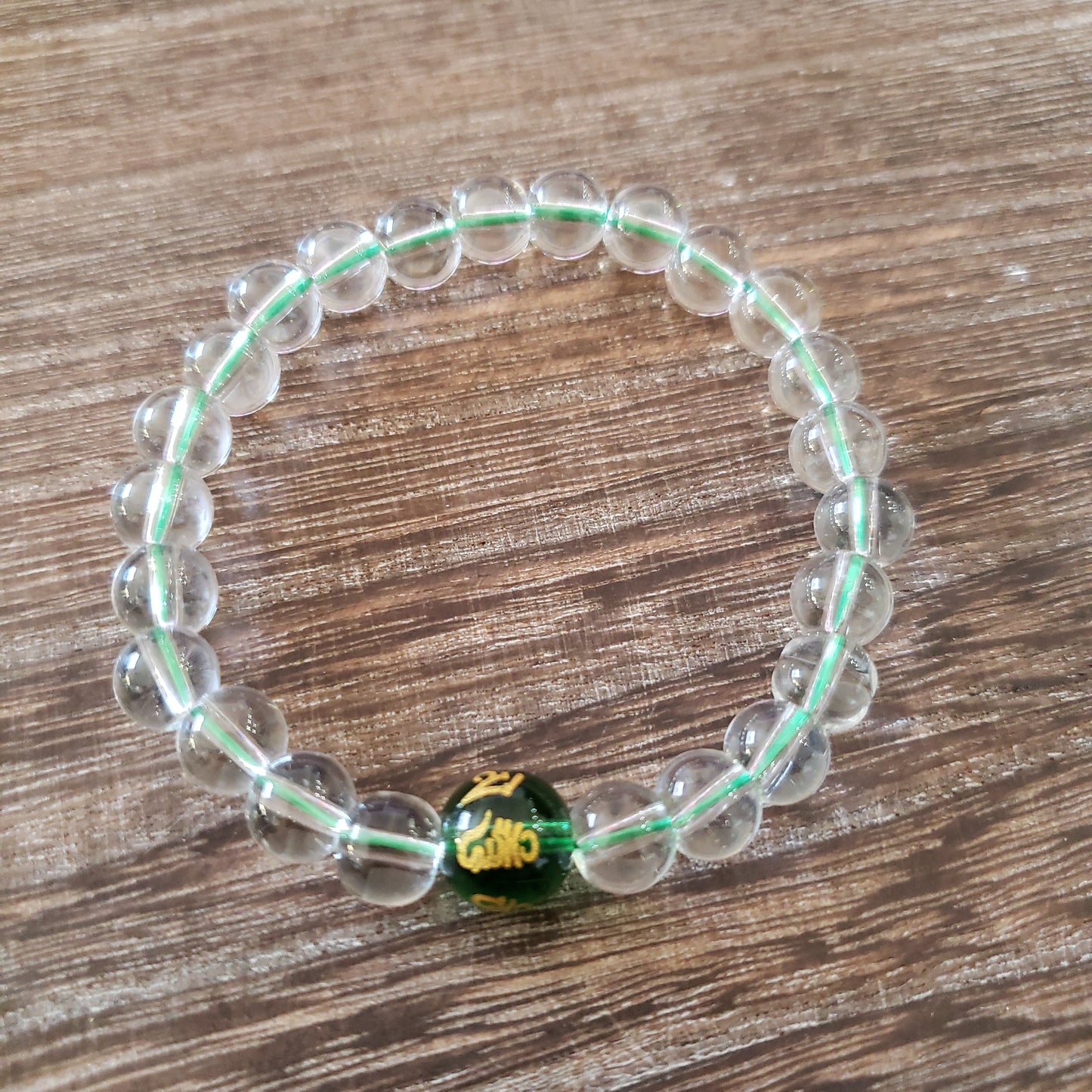 Clear beads with colored mantra & colored string